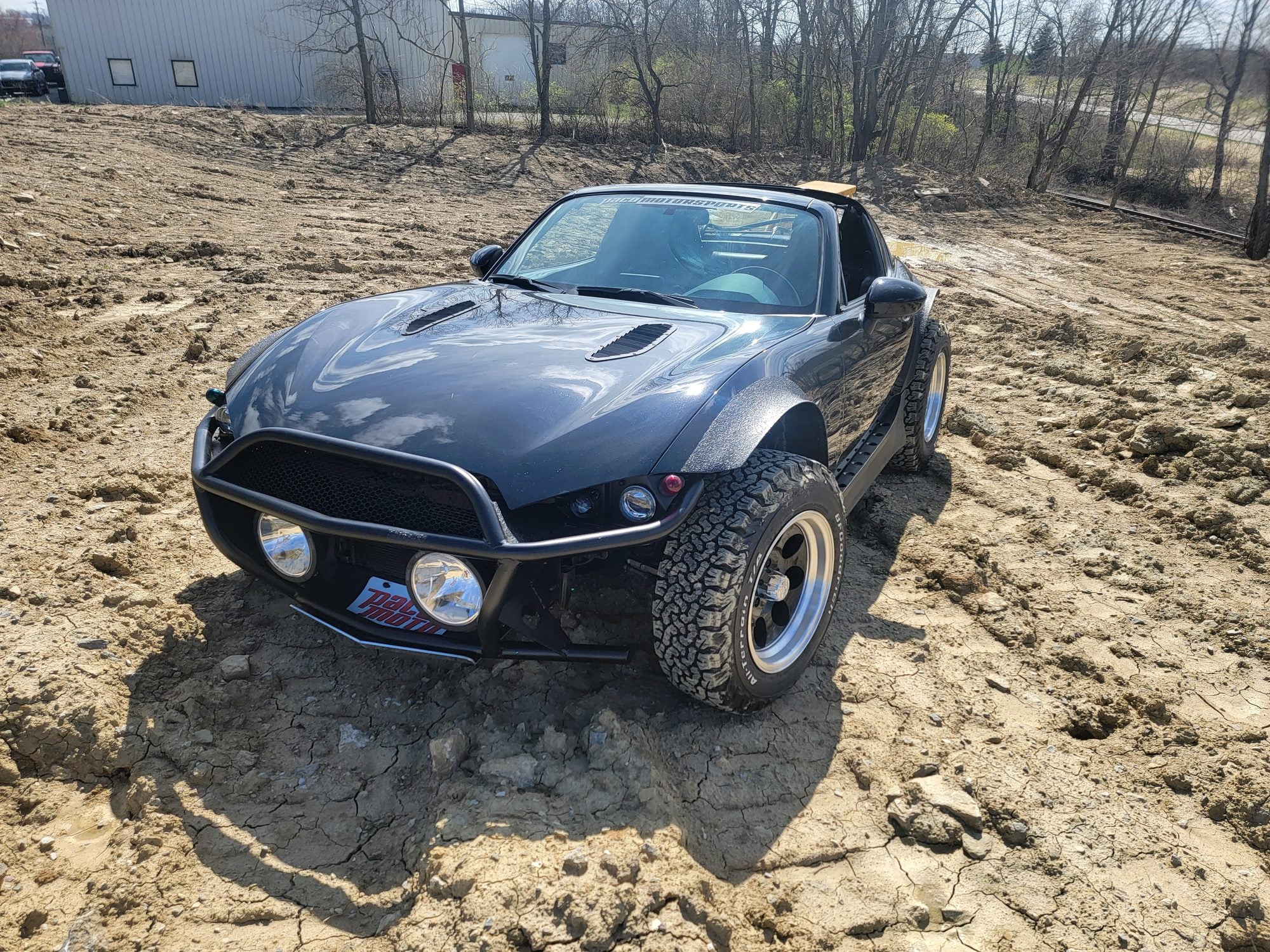 Finished Beachster Mazda MX-5 RF on a dirt road