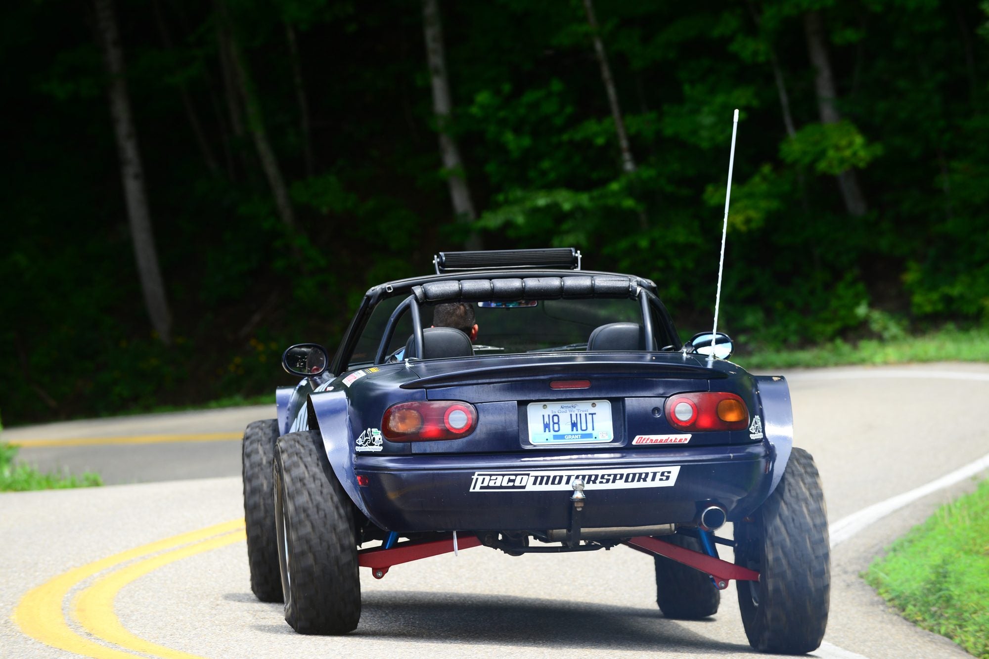 Offroadster driving on a country road