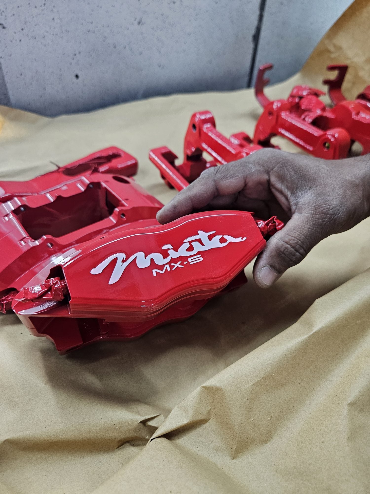 Red Paco Motorsports brake caliper detail for Simba